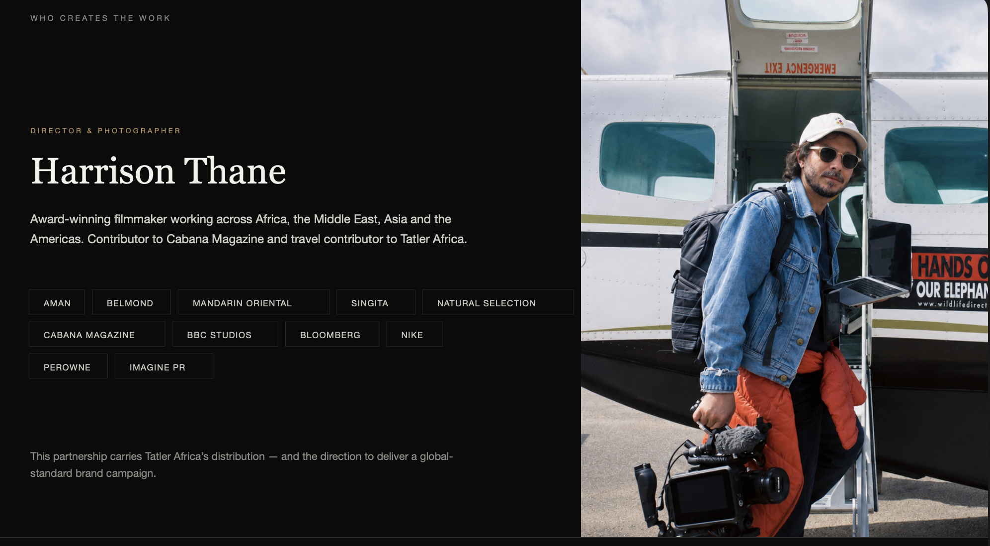 Harrison Thane holding a cinema camera beside an aircraft